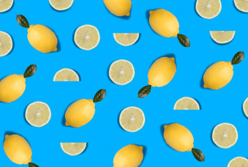 Whole and sliced lemon on the blue background. Flat lay. Pattern. Top view.