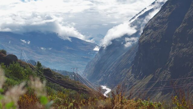 4K shot of clouds above the mountain peaks during the storm at Jispa in Lahaul Spiti district at Himachal Pradesh in India. Clouds covers the peaks of the mountains. Natural background.	