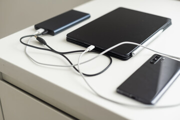 USB charging cables for smartphone and tablet in top view.