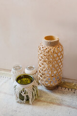 wicker decorated vases and authentic elements of home interior