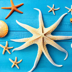 Seashell, starfish and beach sand on blue wooden background