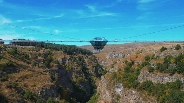 Flying a drone over the Dashbash canyon, view of the glass bridge. Georgia