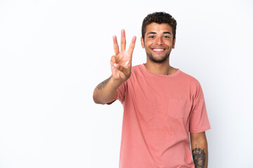 Young handsome Brazilian man isolated on white background happy and counting three with fingers