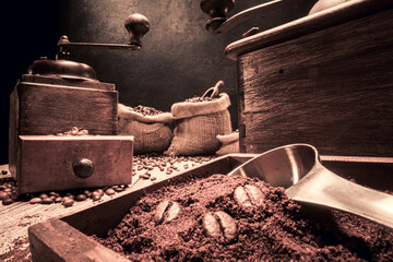 Arabic coffee beans in vintage grinder and old sack.