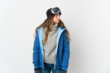 Skier girl with snowboarding glasses isolated on white background looking to the side