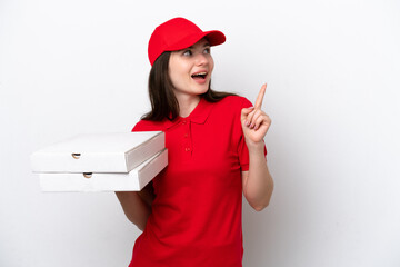 Young Russian pizza delivery picking up pizza boxes isolated on white background intending to...