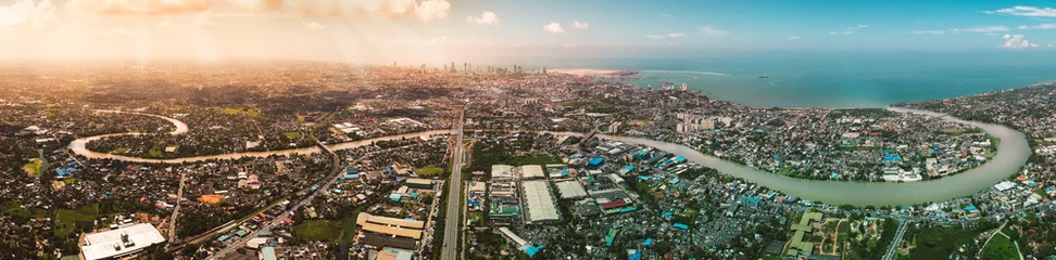 Foto op Aluminium Colombo Skyline, the capital city of Sri Lanka.  Four images merged to create this beautiful Colombo skyline panorama photo. On this photo you will see Kelani River, E03 Express way and beautiful city © Geeth Mendis