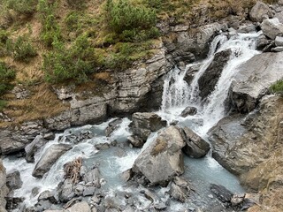 Schmuer Stream or Schmuer Bach (Aua da Fluaz creek) over the lake Panixersee (Lag da Pigniu) and in...