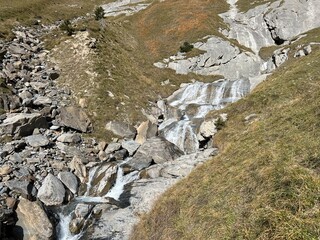 Aua dil Mer stream or Aua dil Mer creek (Aua dil Mer Bach) over the lake Panixersee (Lag da Pigniu) and in the Glarus Alps massif, Pigniu-Panix - Canton of Grisons, Switzerland (Kanton Graubünden)