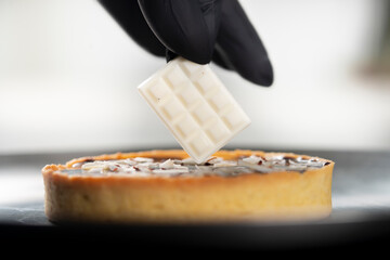 closeup view of the chef decorating the cake