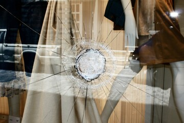 Broken glass of store window at Ermou street, in the commercial center of Athens, after vandalism made by anarchists - Athens,  Greece, June 28 2020.