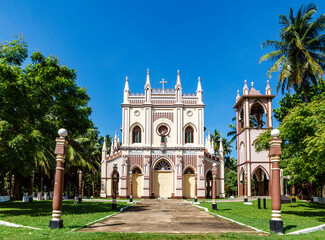 Fototapeta premium Exterior of a Neo Gothic church with bell tower in Negombo, Sri Lanka, Asia
