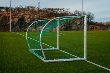 View over the Henningsvaer football stadium in Norway with the sea and islands in the background....