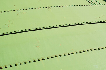view of a green riveted steel facade - 543642422