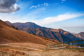Beautiful mountain landscape in sunny weather, against the blue sky. - 543642624