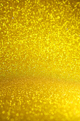 Shiny golden bokeh glitter lights abstract background