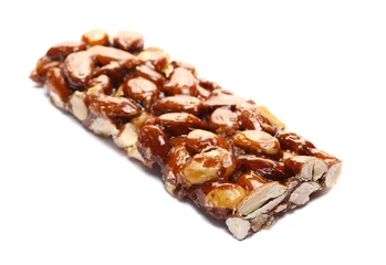 Keuken spatwand met foto Honey granola nut bar with almonds isolated on white © dule964