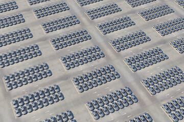 Huge parking lot of a new sports cars waiting to transportation for sale. Several rows of modern electric self-driving cars in storage. 3d Rendering