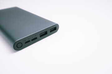 Power bank mockup isolated on white background. Gray metallic USB power bank for smartphones charging isolated on white background. Place for text.