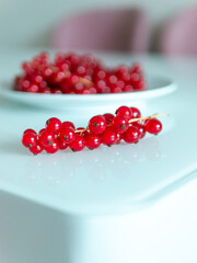 A bunch of red currants on a white background