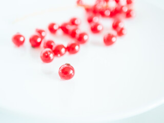 A bunch of red currants on a white background