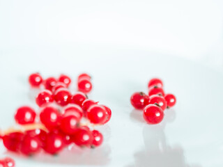 A bunch of red currants on a white background