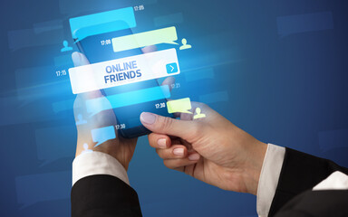 Hand using smartphone with social media concept