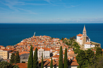The old medieval centre of Piran on the coast of Slovenia. The large church is  St George's Parish...