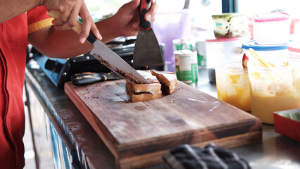 The process of making Indonesian traditional street food sweet martabak (martabak manis)