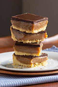 Scottish Caramel Slice or Millionaire's Shortbread Confectionery Dessert with Layers of Chocolate and Caramel over Shortbread Crust