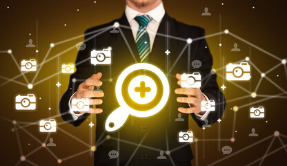 Hand holding social media icons