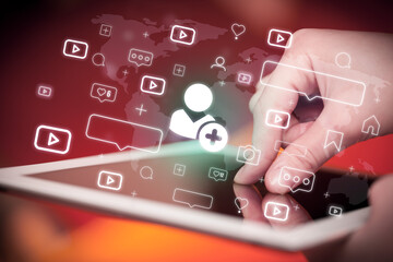 Close-up of a hand using tablet, social media concept