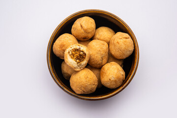 Dry kachori is a dry fruits stuffed ball shaped farsan also called kachauri, kachodi and katchuri - obrazy, fototapety, plakaty