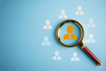 Human Resource Management, Magnifier glass focus on the manager icon which is among staff icons for human development recruitment leadership and customer target group concept, HRM - obrazy, fototapety, plakaty