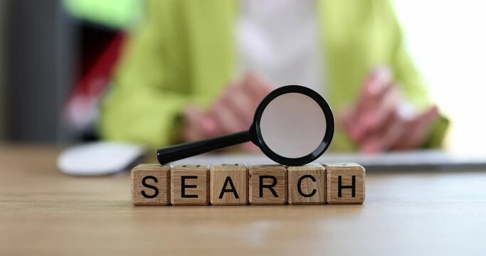The search is written on wooden cubes, closeup