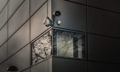 Surveillance camera for mounted on outside wall of Modern building. The concept of surveillance and visual inspection that has been developed, Selective focus.
