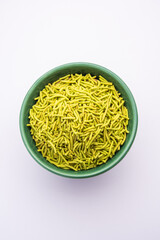 palak sev is a crispy crunchy green colored spinach flavored fried farsan with salt, spice powder