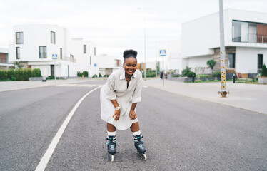 Laughing black lady in roller blades