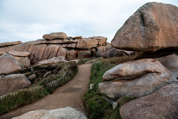 France, Ploumenach, 2022-01-13. Rock formation along the pink granite coast in Brittany. 