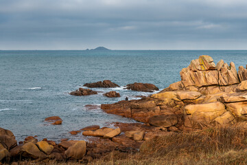Fototapeta na wymiar France, Ploumenach, 2022-01-13. Rock formation along the pink granite coast in Brittany. 