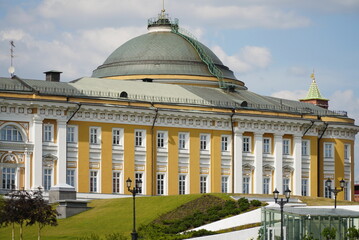 The Senate Palace in the Kremlin against the background of white clouds on a clear sunny day,...
