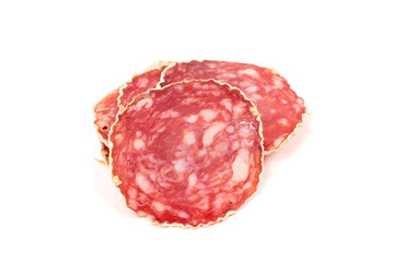 Slices of salami sausage on a white background
