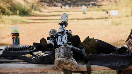 Kalashnikov assault rifle in a deep modification with a silencer and an optical sight