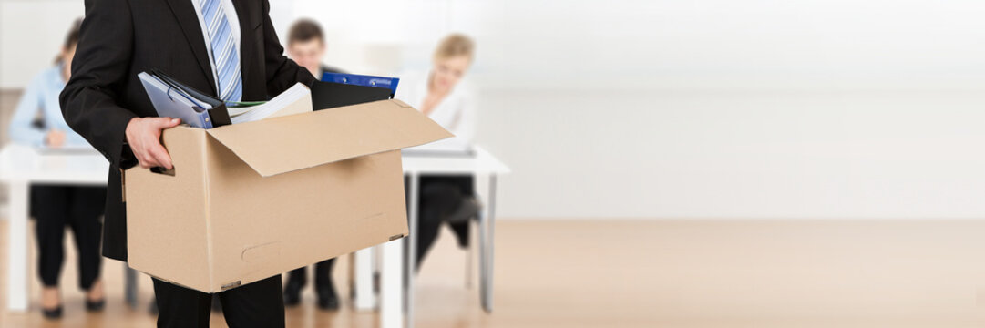 Businessman Moving Out With Cardboard Box