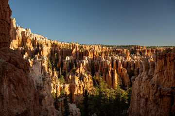 Deep Blue Sky Over The Receeding Shadows In The Hoodoos Below