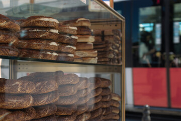 close-up photo of bagels at the bagel stand with tram in the background