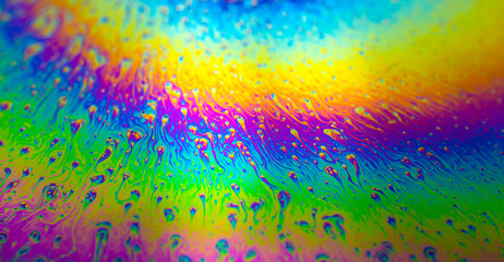 Photo of iridescent surface of soapy water. Space, halographic, psychedelic background for...