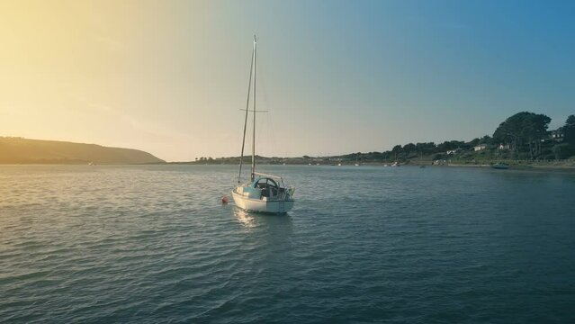 Circling A Yacht In Sun Glow