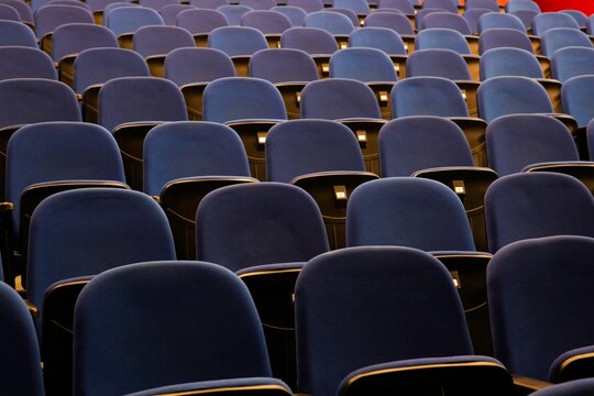 Closeup shot of blue seats in an empty conference presentation hall