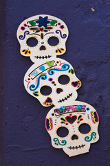 Texture of skulls and colorful handmade skulls of the day of the dead tradition in Mexico